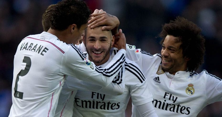 Raphael Varane and Marcelo congratulate Karim Benzema on his scoring against Real Sociedad