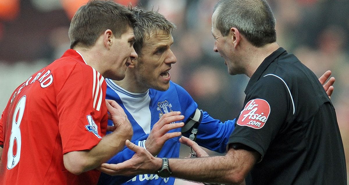 Atkinson is approached by Steven Gerrard and Phiul Neville furing the Merseyside derby of February 2010