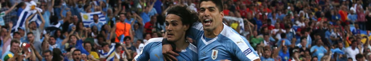 Edinson Cavani of Uruguay celebrates with Luis Suarez